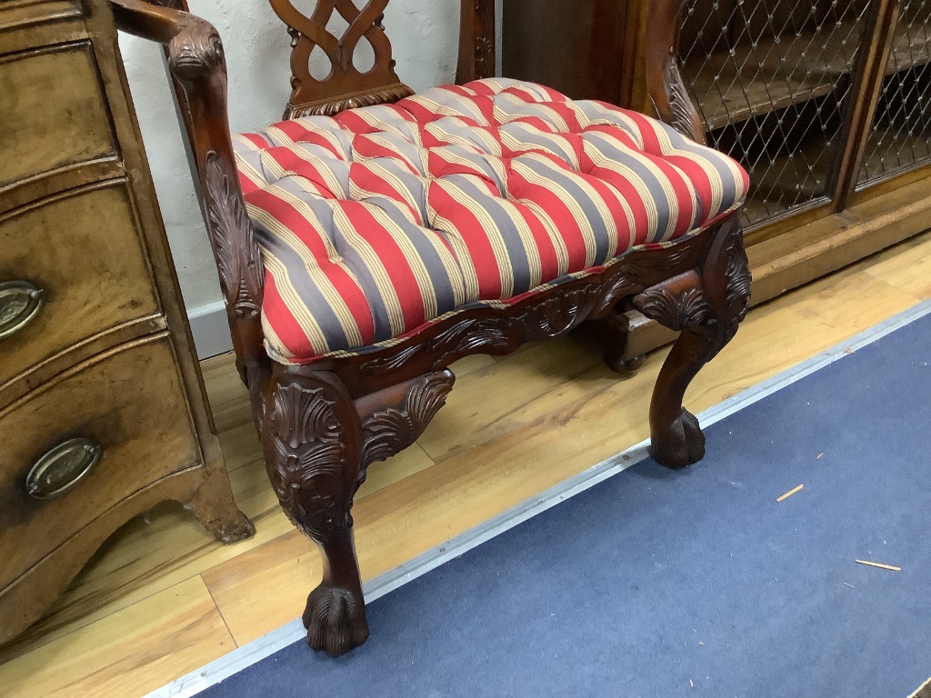 A pair of George III style Irish design mahogany elbow chairs